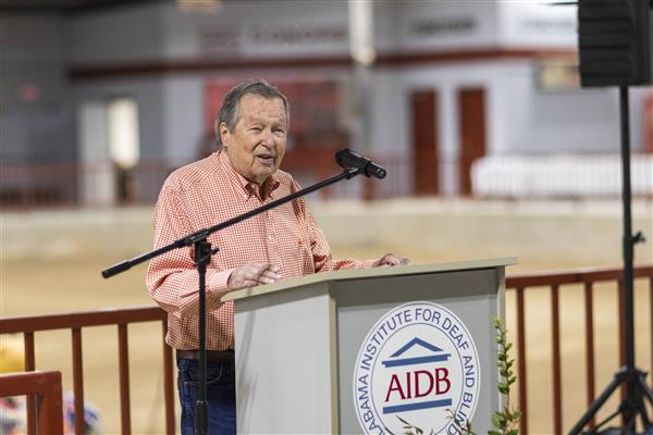 Mr. M. P.  Greene, Jr. speaks to the audience from the podium.